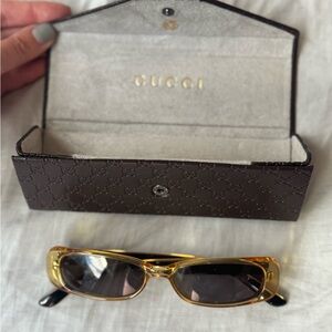 Gucci Black and Gold Frames
